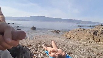 A Voyeuristic Couple Watches A Nude Milf On The Beach